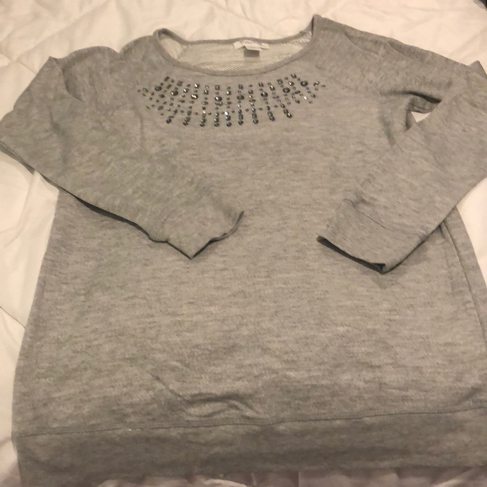 Grey sweater with embellishment at the neckline